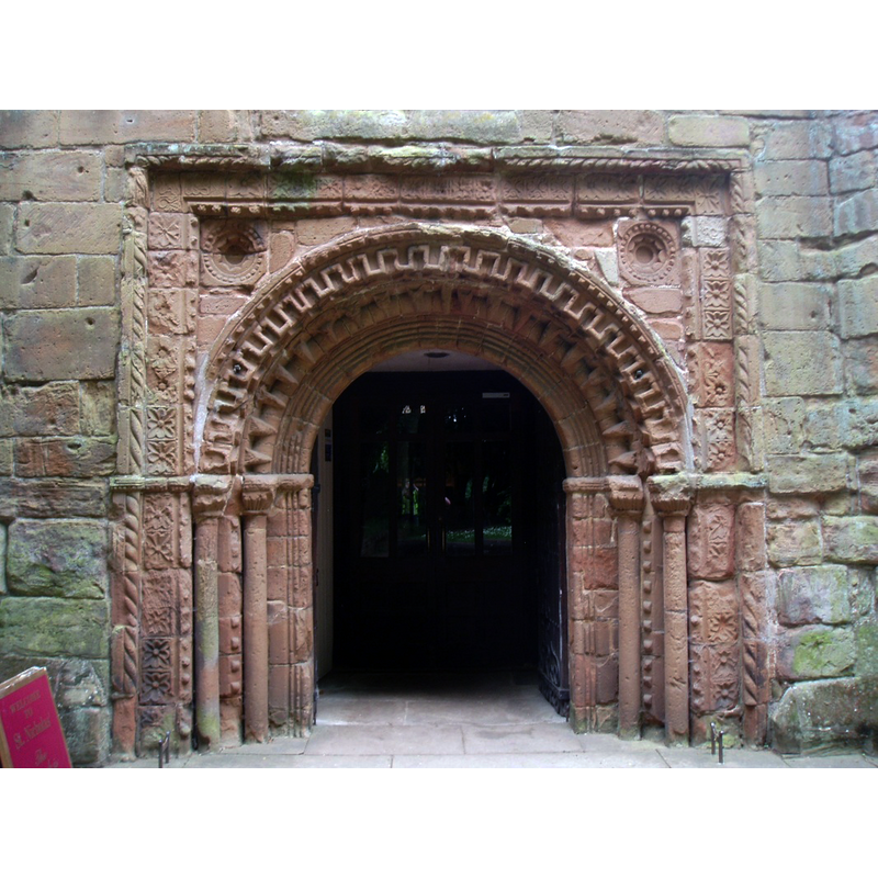 the old Norman portal; probably the original one at the abbey, now mounted at the base of the church tower, west side