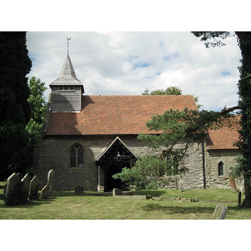 Source caption: "Church of St Mary the Virgin, Wolverton. Founded 1208, says a handout in the church. Dwarfed by colossal conifers. Of the interior, the guidebooks remark upon the full-height wooden screen and the stained glass, including a window by William Morris."