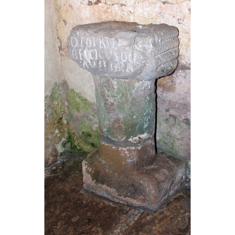 Source caption: "Roman altar , Michaelchurch church. Now located in the old north doorway in the church of St Michael the Archangel. The inscription reads
"DEO TRI[VII] BECCICUS DONAVII ARA[M]" "Beccicus dedicated this altar to the god of the crossroads""