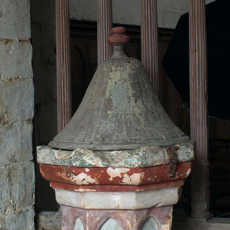 showing the much damaged upper rim and the metal lock of the cover