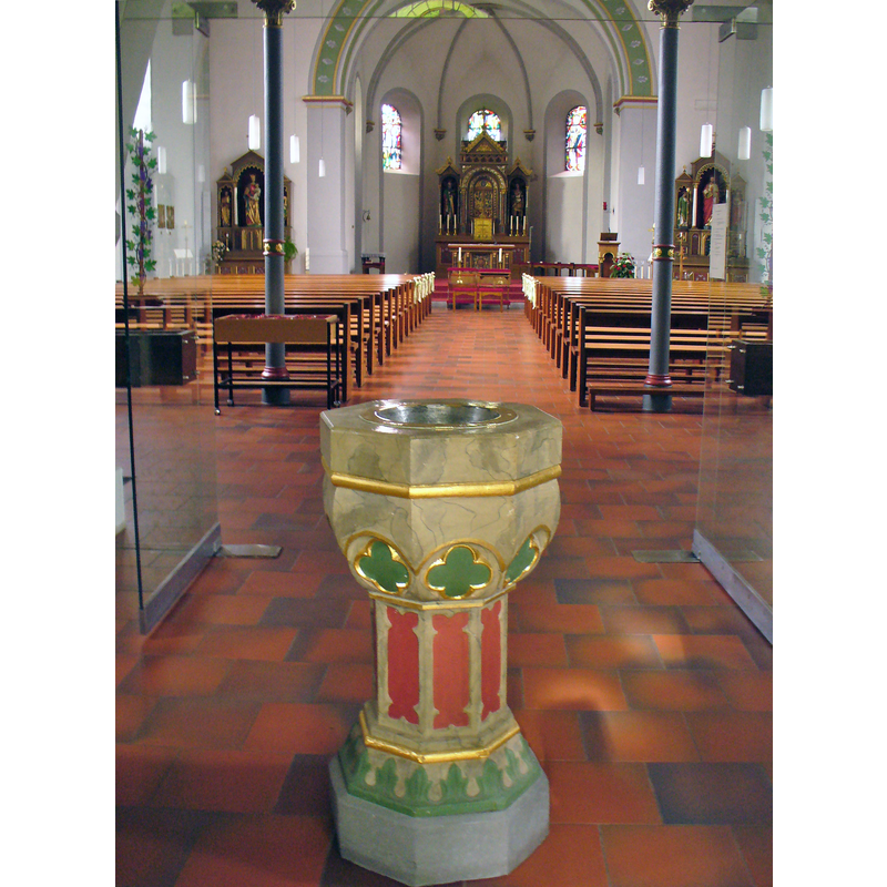 with a late holy-water stoup in the foreground