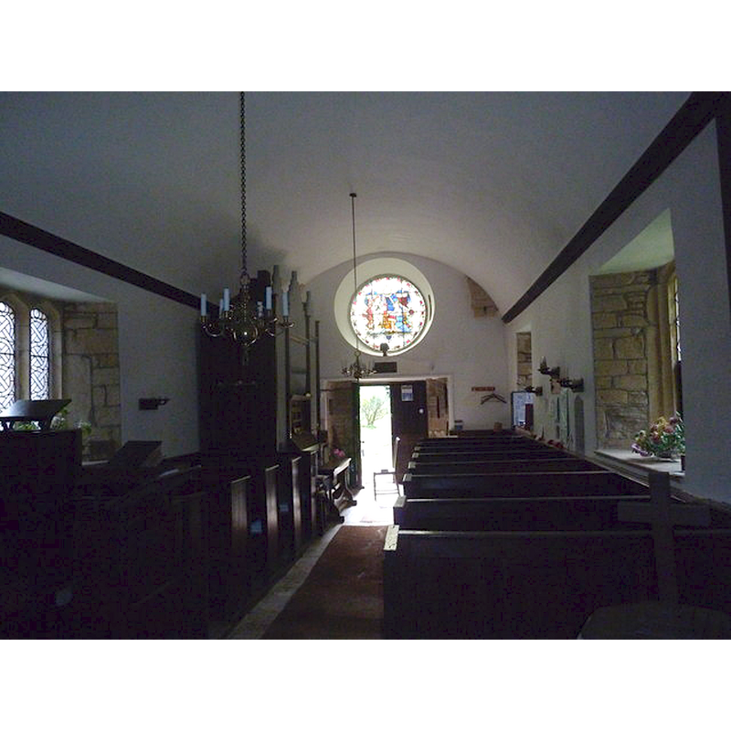 the cross visible in the foreground, right side, is the finial of the font cover