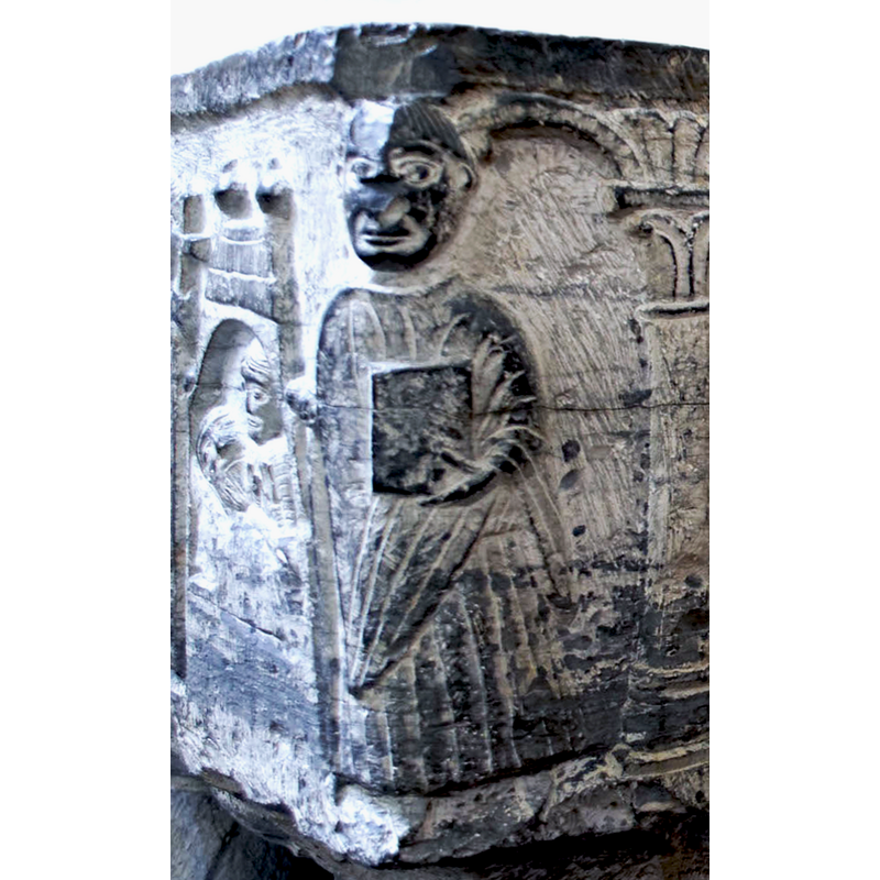 holding a book in his left hand -- on the northeast corner of the basin [NB: orientation is approximate]