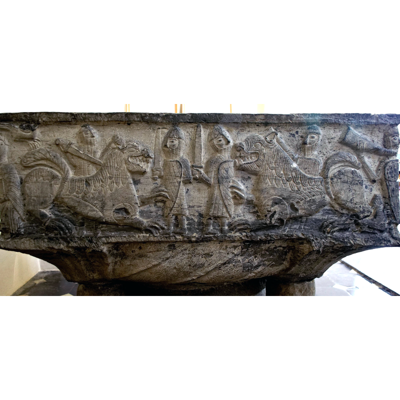 four warriors in full armour with swords and shields fight two large lions -- on the south side of the basin [NB: orientation is approximate]