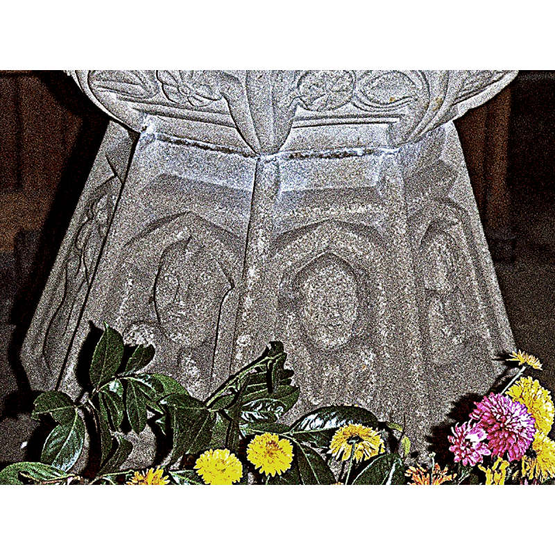 pentagonal frames on the sides of the base contain figures or symbols