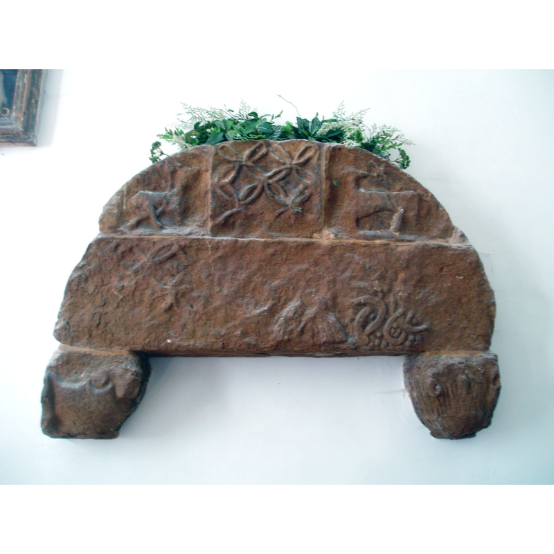 Source caption: "On the south wall is a weathered Norman tympanum, a reminder of the preceeding building on this site."