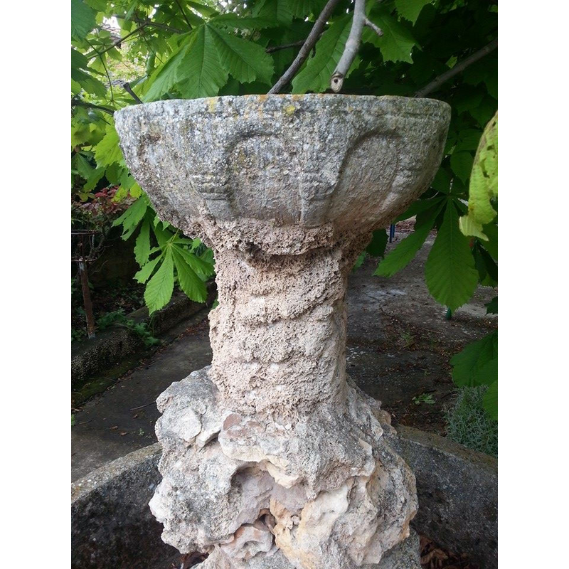 a much damaged stoup in he churchyard