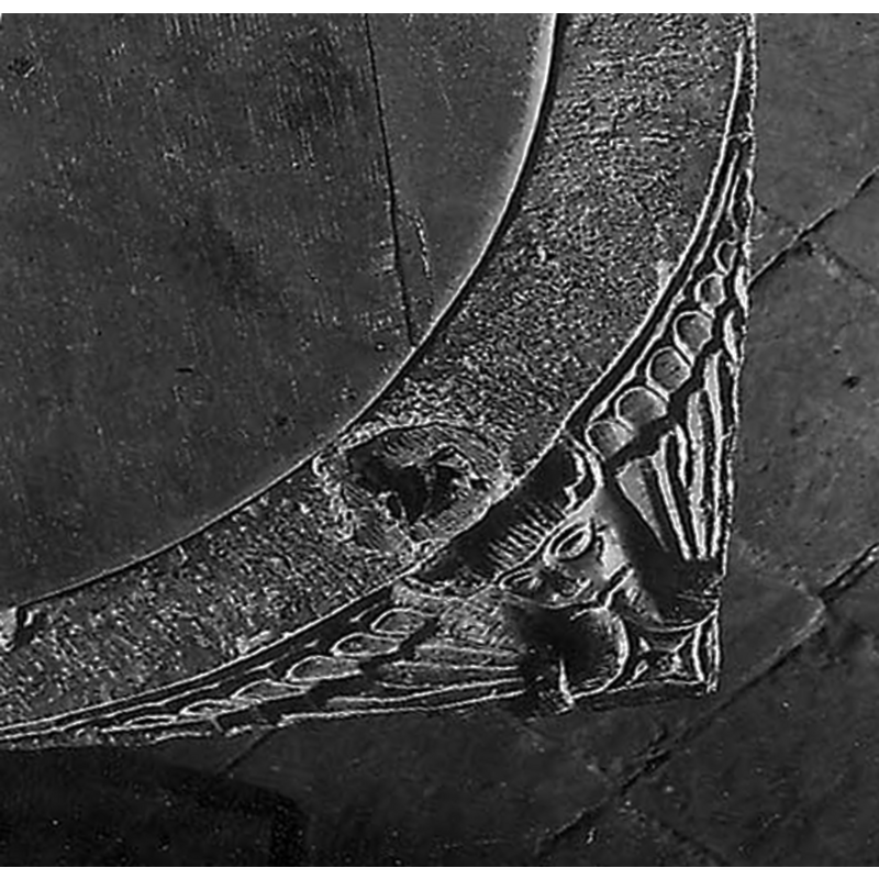 in one of the spandrels of the upper surface of the basin