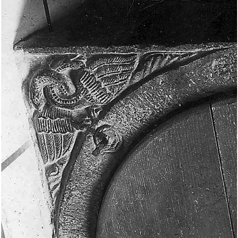 in two of the spandrels of the upper surface of the basin -- Ghislain (2009) describes them as "dragons ailés", but they look more like swans -- notice the metal spike, part of an old cover hardware