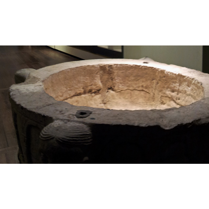 Source caption: "Baptismal font (Mosan, 12th c) and other works of Mosan Art in the collection of Museum Grand Curtius, Liège, Belgium."