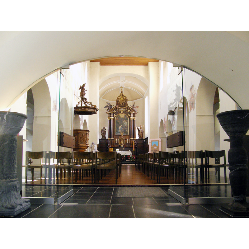 in the foreground are two large holy-water stoups made from re-cycled columns
