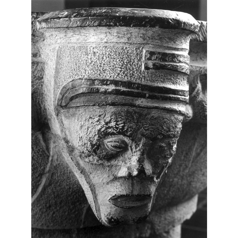 a very curious rendering; the 'hat' has an odd motif on its front; the face appears to have been painted  to achieve a singular effect
