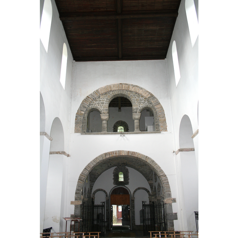 the font is in the tower space, left [south] side, between the railing and the west entranceway