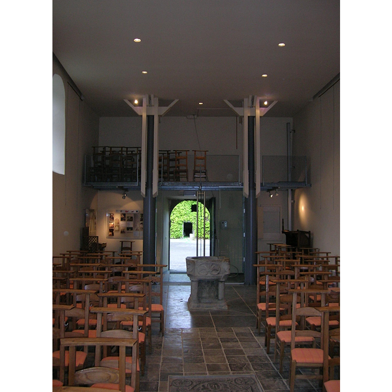 the font standing at the centre aisle, as displayed after the 1990s renovation of the church