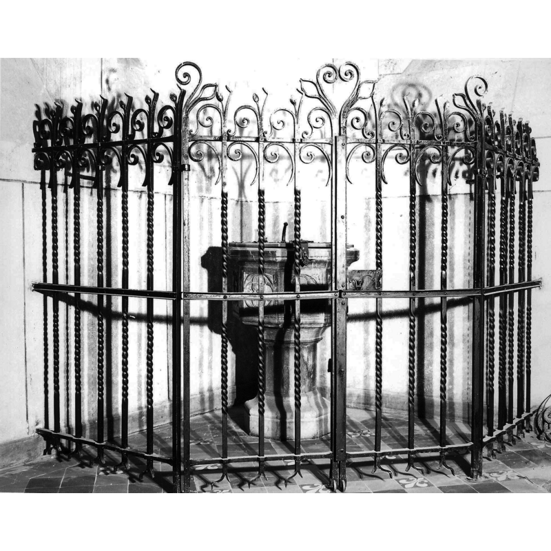 the 19th-century baptismal font and cover in its enclosure