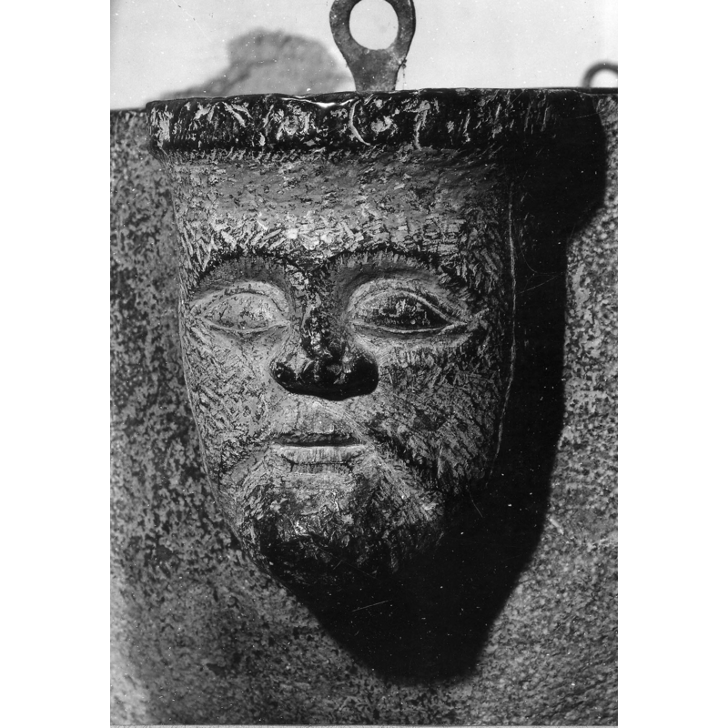 one of two visible heads; there could be two others buried in the south wall