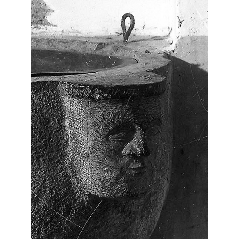 one of two visible heads; there could be two others buried in the south wall