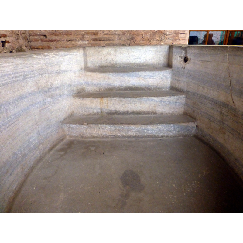 up on the right side, byt the top step, is a carved cross with a hole in its centre