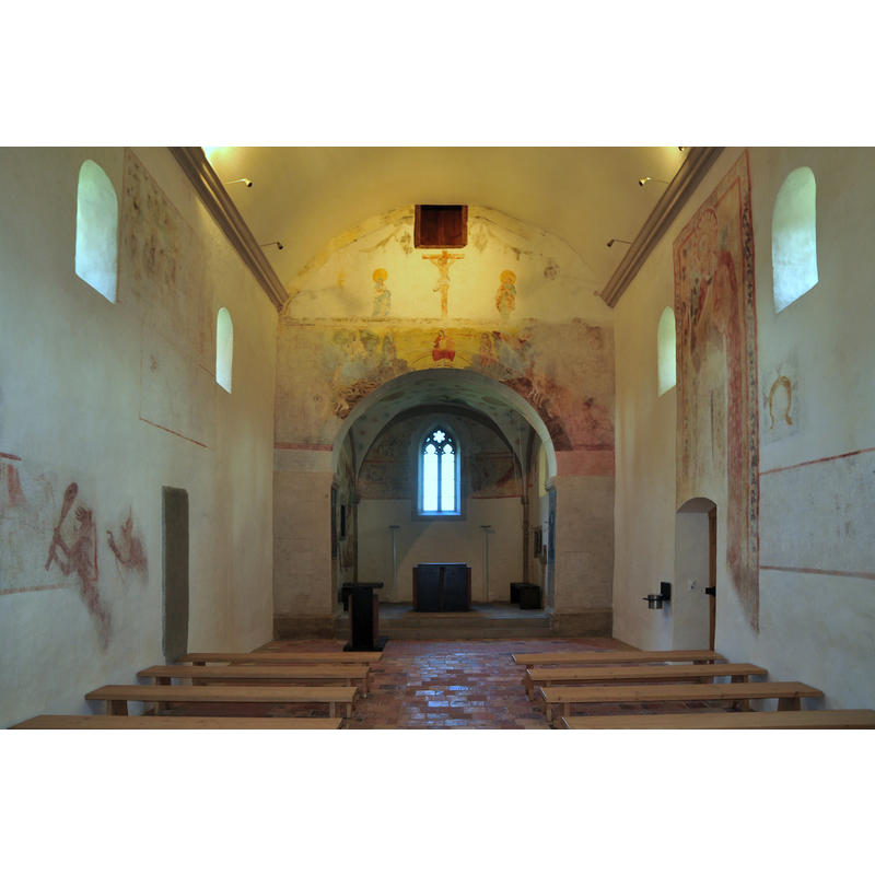 the chancel appears to located beneath the tower, itself attached to the east end of the church -- Source caption: "St. Peter und Paul was built in 1142, a former building is first mentioned in 970 A.D. St. Peter und Paul was for centuries a Parish church, situated on the Ufenau island (Zürichsee) in Switzerland. Ulrich von Hutten (*1488; †1523) refuged on the island and is buried besides St. Peter und Paul."
