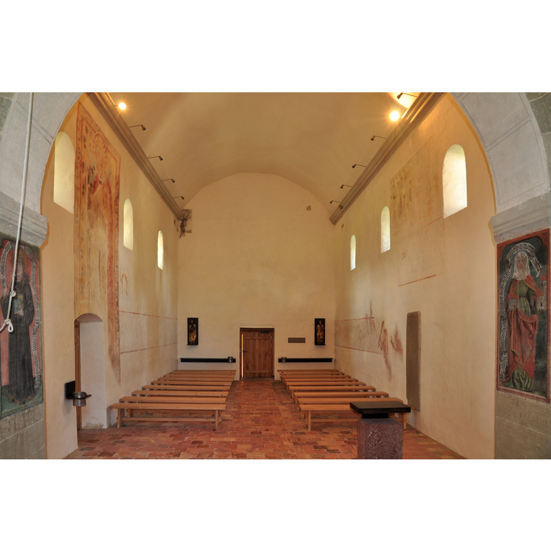 the west entrance at the far end [NB: the tower is attached to the east end of the church]