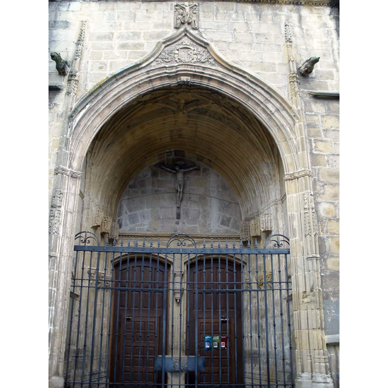 with a free-standing stoup by the pillar between the two doors