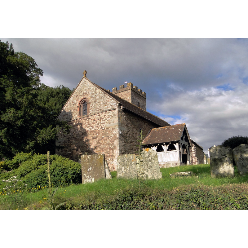 Source caption: "St Andrew, Bredwardine. An ancient church, but the 'Norman' west window dates from the Nicholson restoration of 1875-6, according to the latest edition of Pevsner."