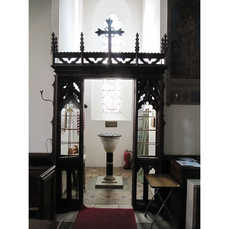 the modern font in the context of the tower space, behind a ornate screen