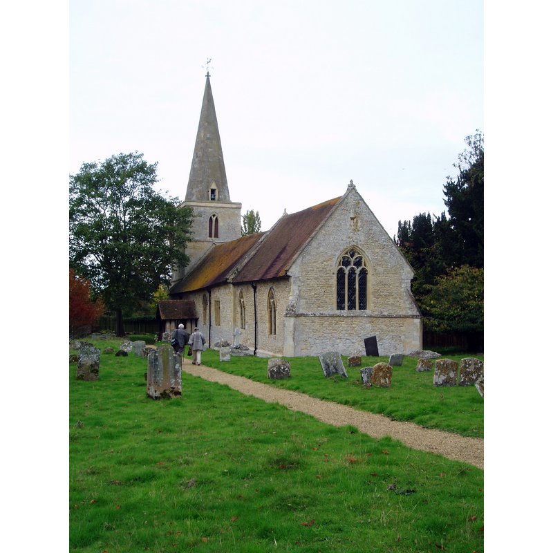 Source caption: "St Giles's church at Newington dates mostly from between the 12th and 14th centuries and consists of chancel and nave without aisles and a small north transept, dominated by the c1300 west tower and spire. It is sadly no longer used for services and facing an uncertain future, and is generally closed to the public. There are some real treasures within; there is outstanding 15th century stained glass in the north chancel including an Assumption of Mary and a Holy Trinity group, with donor figures below. (a further fragment of Mary from an Annunciation is in a south nave window)."