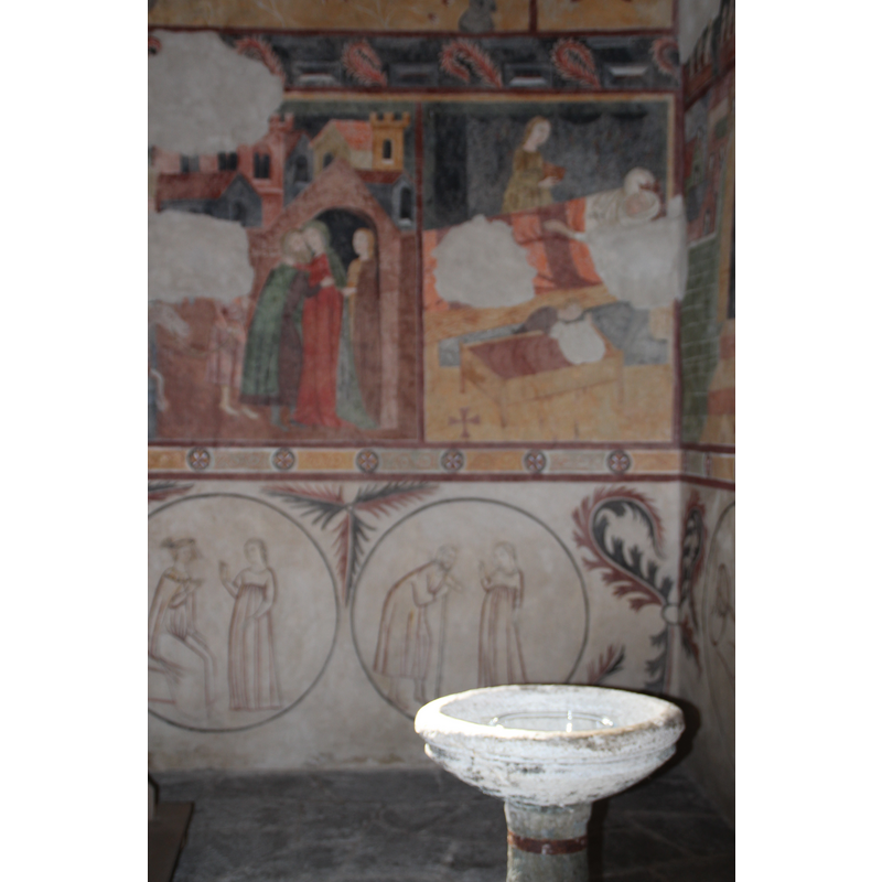 a later-date stoup located at the west end of the nave, south side, opposite the old basin