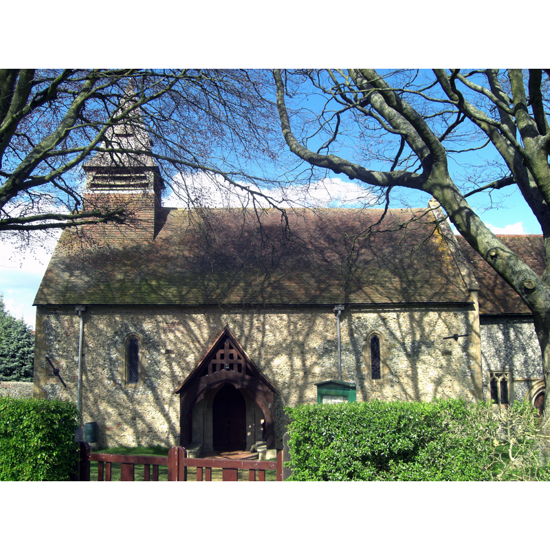 Source caption: "St Nicholas Church, Beedon. Built of flint the nave and chancel date from circa 1200-30. Note the lancet windows and the shingled broach spire."