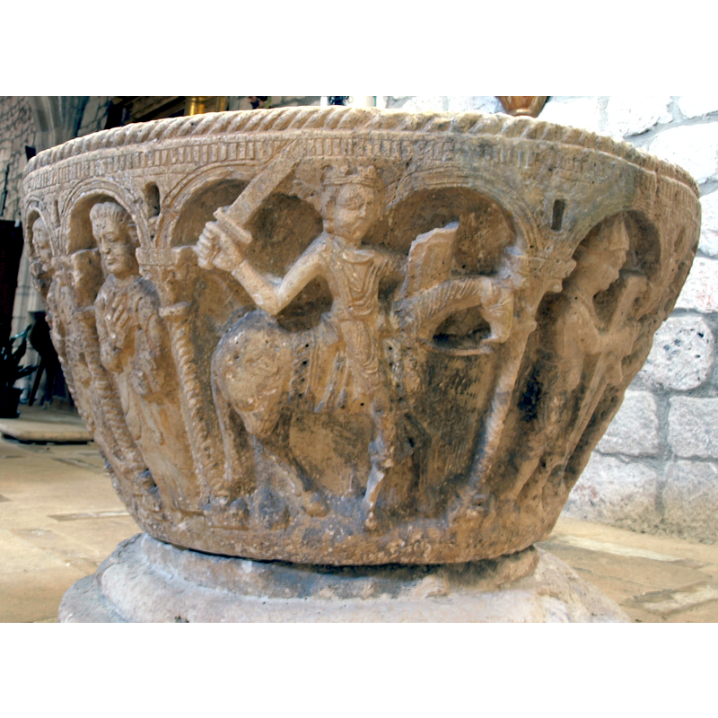 on the southeast side of the basin [NB: orientation is approximate] -- a mounted king armed with raised sword and shield passant to the right -- the scene occupies two arches and there is no supporting column in the middle