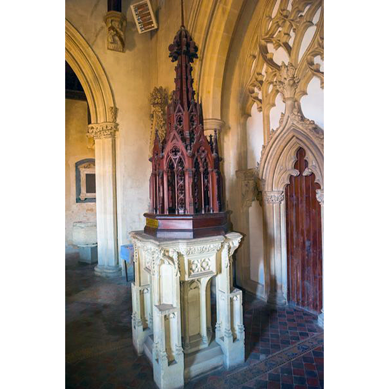 the moder font and cover in the centre of the image; the old font can be seen in the back, behind the arch