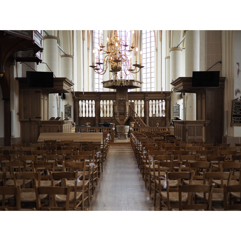 the baptismal font is now located at the east end, by the chancel screen