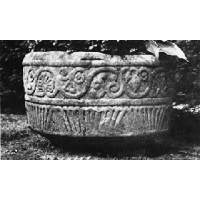 in the context of the garden where it served as water-trough; much damaged, and missing a considerable part of the upper rim