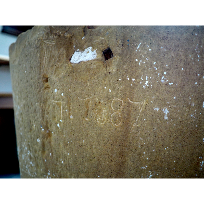 graffiti? -- notice also the square hole cut into the side above the graffiti