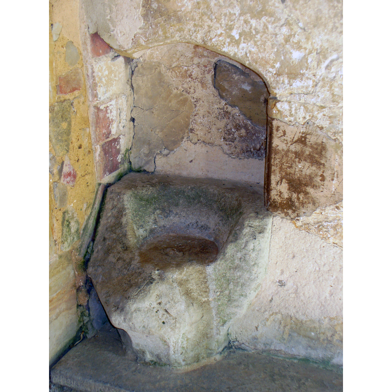 located in the porch [cf. FontNotes] -- is this an old font re-set into a wall? a piscina? a stoup? [NB: there appears to be a drain hole in the centre of the inner basin