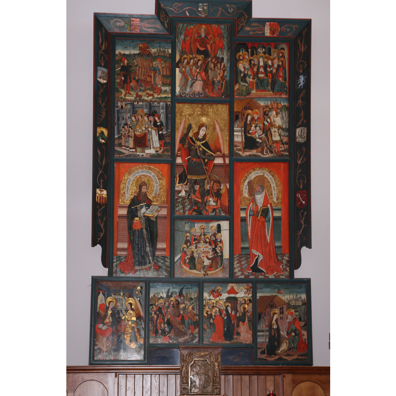 Source caption: "The Gothic altarpiece of the high altar of Saint Michael of Vielha date from the fifteenth century. It is attributed to the "Master of Vielha", still anonymous, who seems to be a disciple of Pedro García de Benavarre, who worked in Barcelona, Lleida and Huesca [...] The central panel and the three on top left illustrate the legend of Saint Michael. Those of right corner depict scenes from the life of the Virgin Mary. Below Saint Michael panel is representrd the Last Supper. On each side are represented the apostles St. Peter and St. Paul."