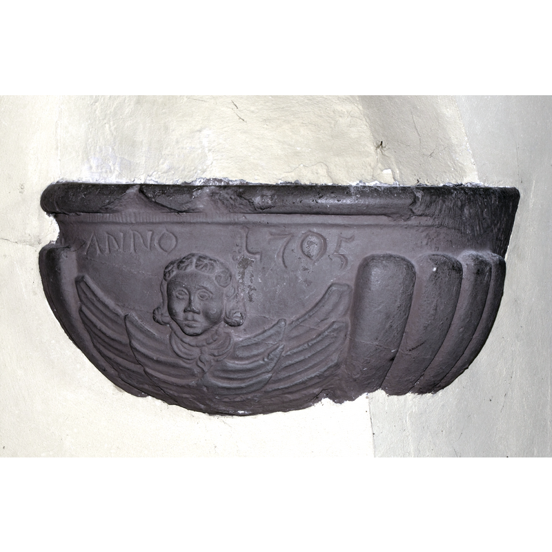 a later wall-mounted stoup of 1705