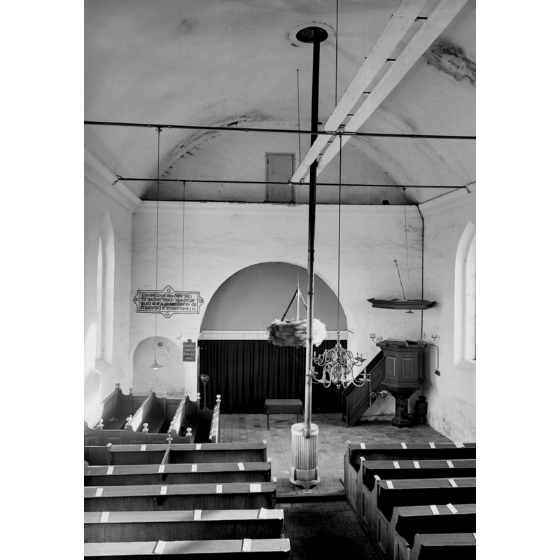 in December 1940, before the discovery of the frescoes on the north side wall, near the northeast corner; notice also that the font had not been moved here yet