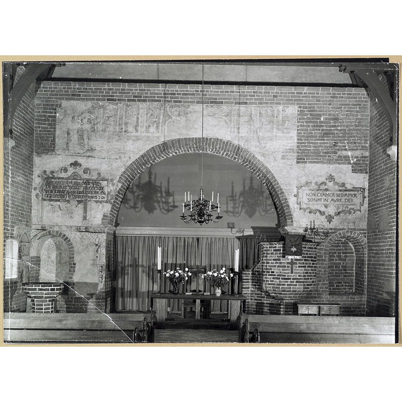 by 1946 the frescoes hidden in 1940 had been uncovered and the brick font had been placed in this northeast corner
