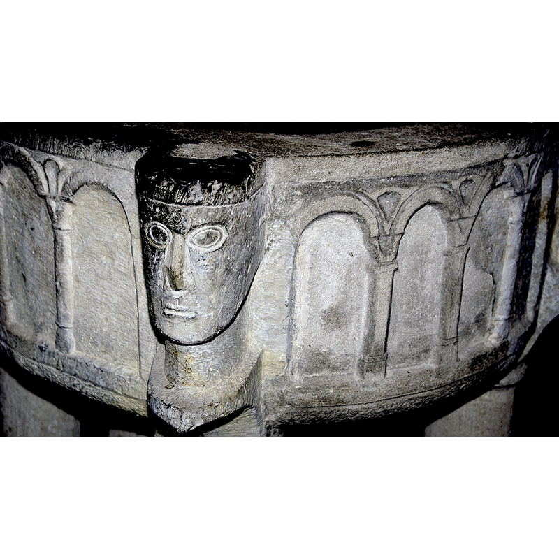 one of the anchoring holes of the old font cover is visible here on the upper flat surface of the rim
