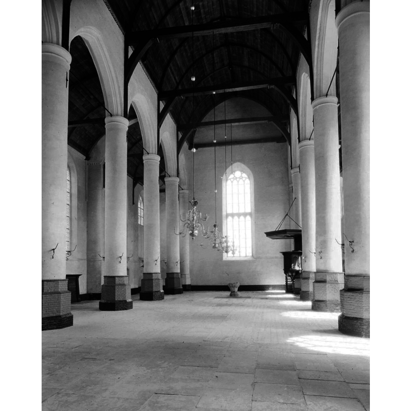 with the font at the middle of the east end -- the church had just been restored after the damage caused by WWII