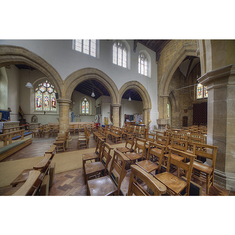 looking across the nave to the south aisle; the modern font can be seen at the west end, by the south pillar of the tower arch