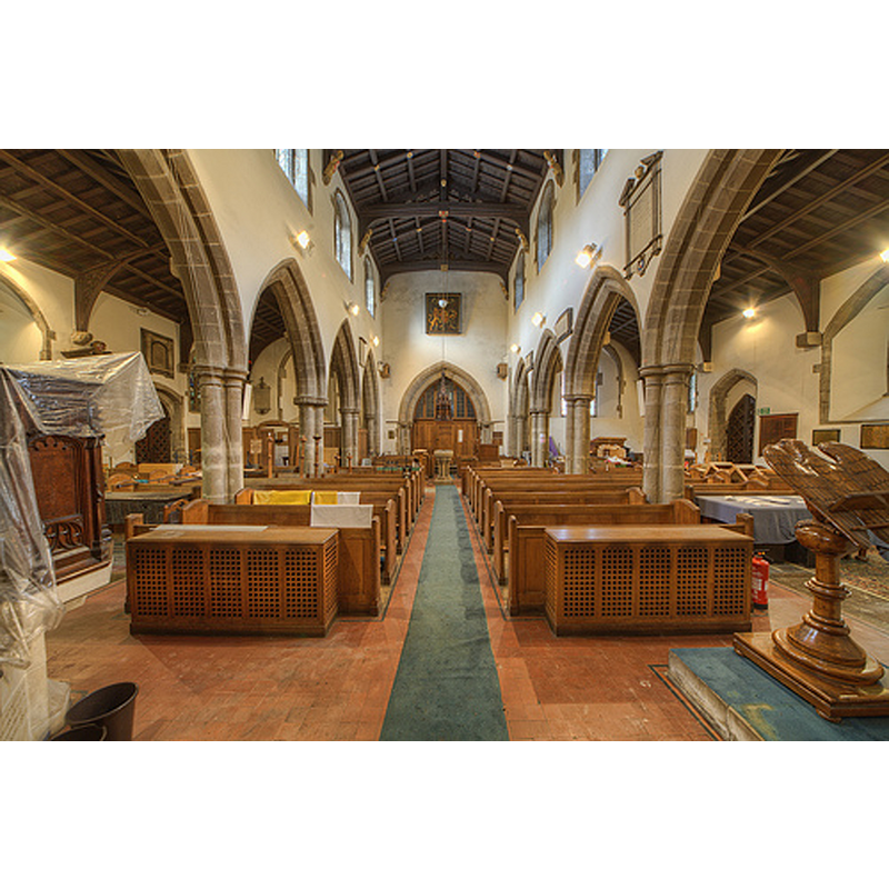 Source caption: "The four bay arcades date to the 13th century, wooden roof is 16th century" -- the 13thC font is visible at the west end of the centre aisle