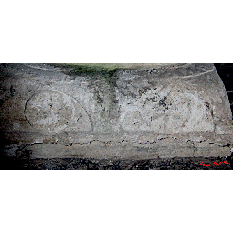 the side is very eroded but a cross is discernible in each semicircle