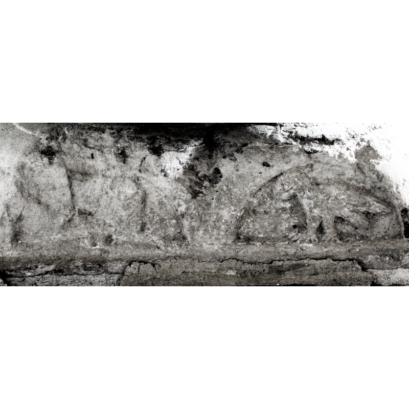seen here on the right side of the image; passant to the left [NB: this side is much eroded and damaged]
