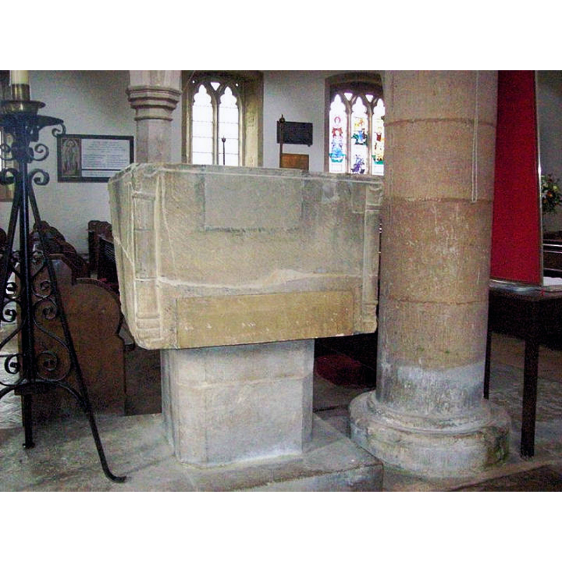 at the west end, by a pillar of the south arcade