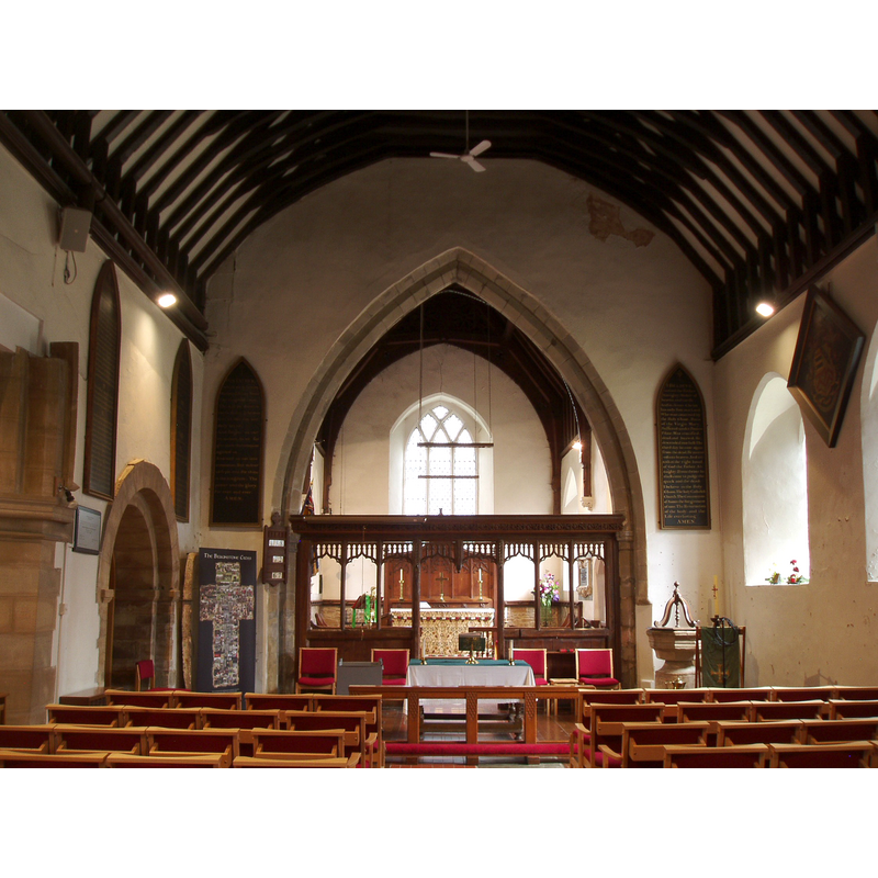 the font and cover are visible in the nave, to the right [south] side of the chancel arch