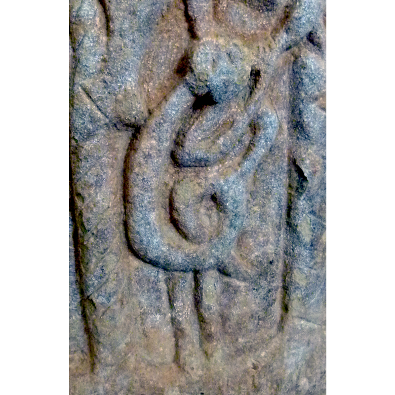 it is clearly a human figure interwined with the bodies of the two (?) snakes