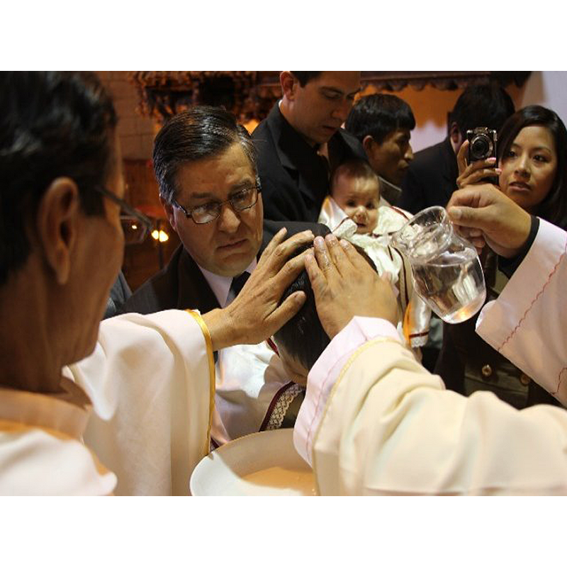 view of a recent [2014] baptismal scene in the Iglesia de San Blas, Cuzco [NB: notice that the font is modern, and the baptizand is not an infant]